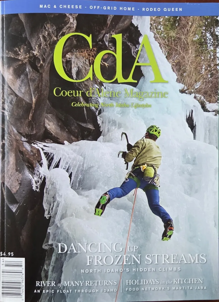 The cover of Coeur d'Alene Magazine, an ice climber on a frozen waterfall