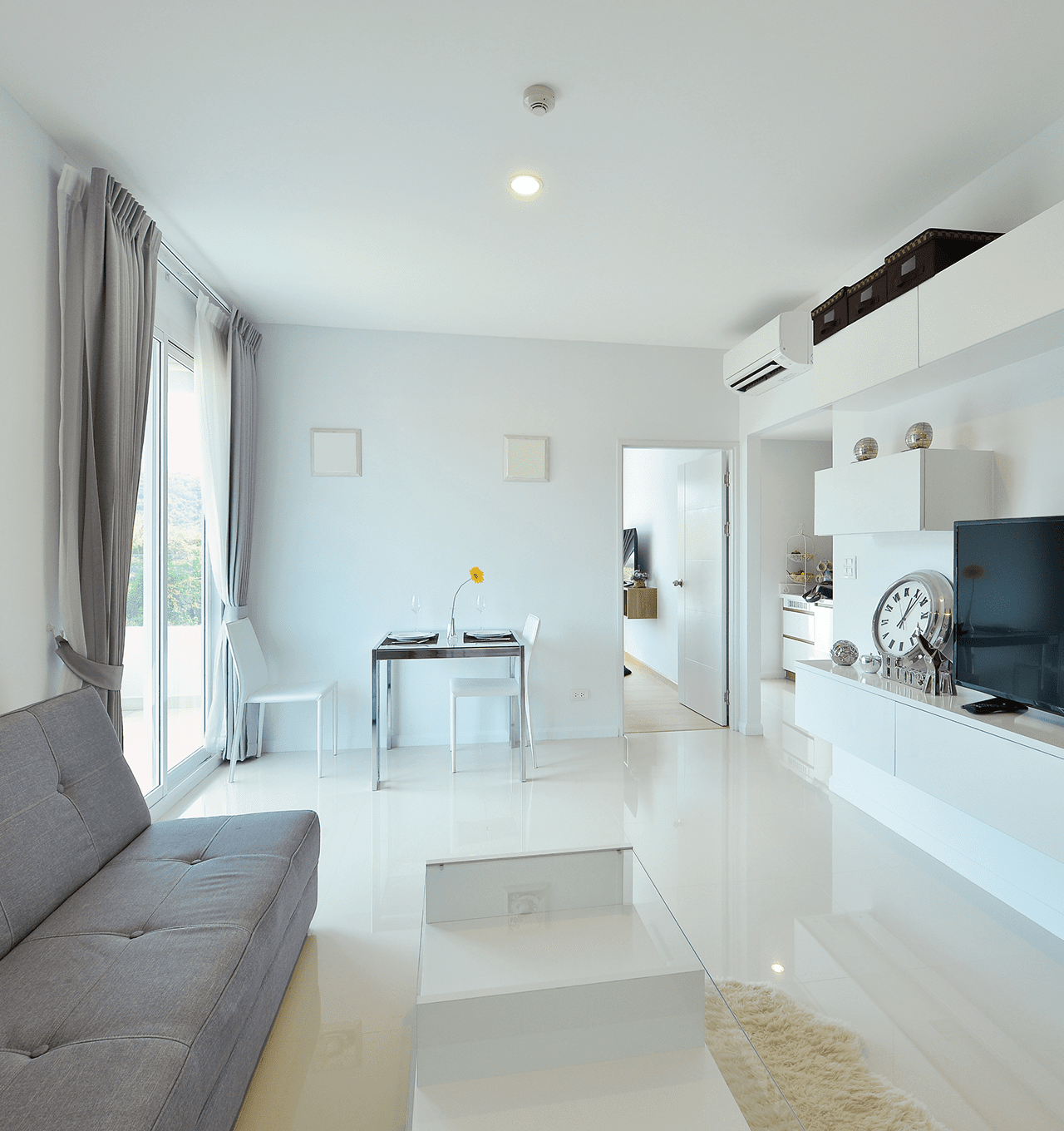 Bright apartment interior with white furniture