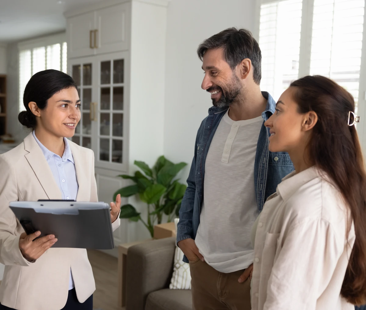 Couple discussing with real estate agent